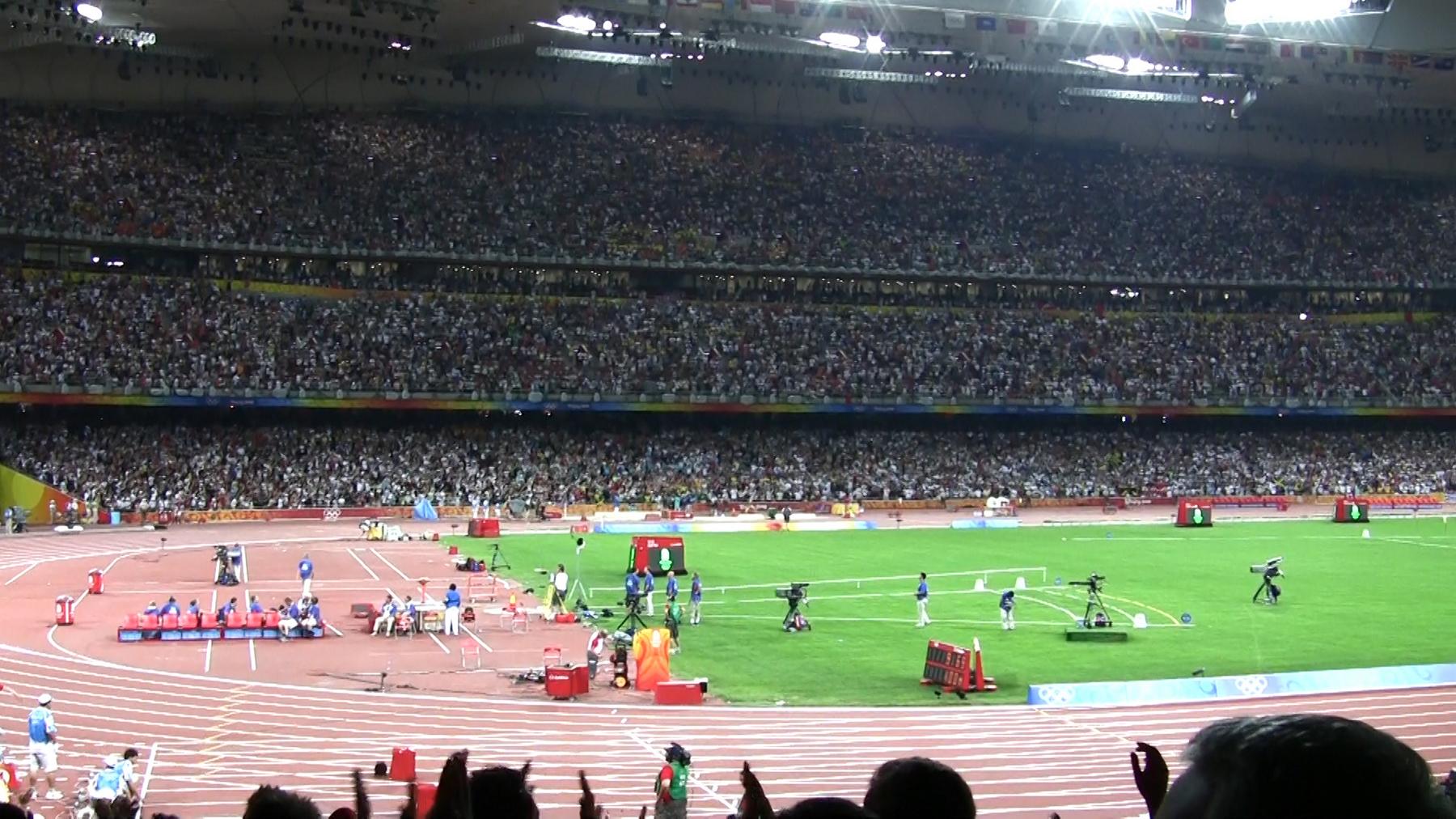 View of the crowded Beijing 2008 Olympic stadium with the track and field.