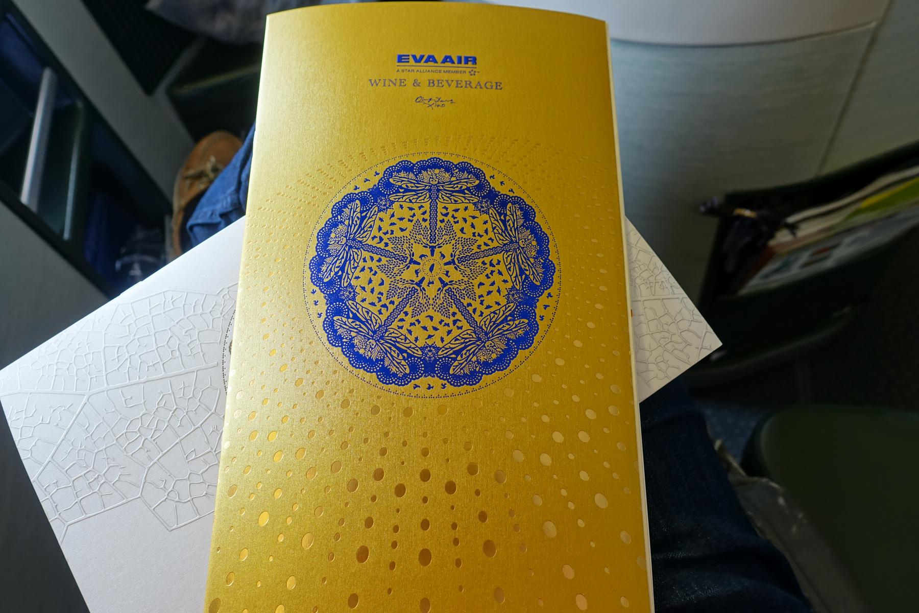 A gold and blue EVA Air business class wine and beverage menu.