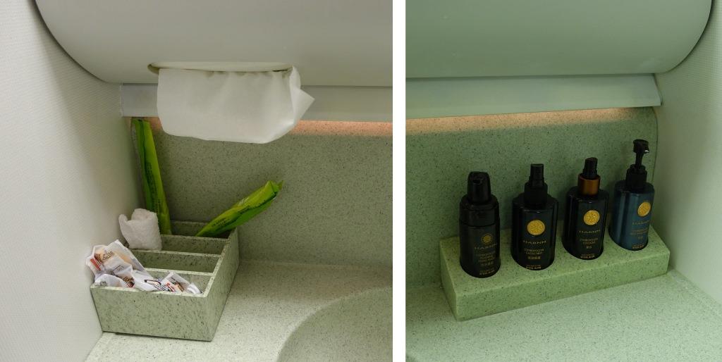 Eva Air Business Class lavatory features a selection of HARNN toiletries and other amenities.