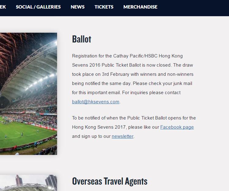 A packed rugby stadium at night, illuminated by stadium lights and fireworks.