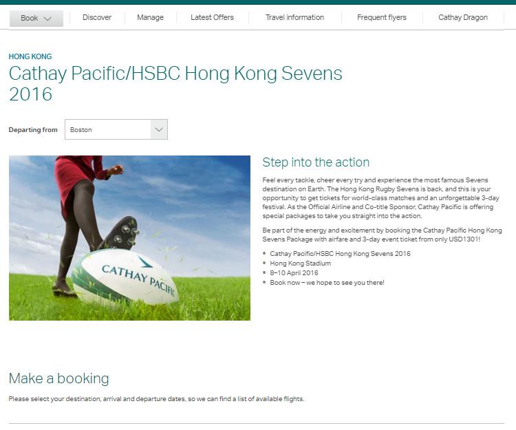 Person in a red skirt and black tights with a foot on a Cathay Pacific branded rugby ball on a grassy field.
