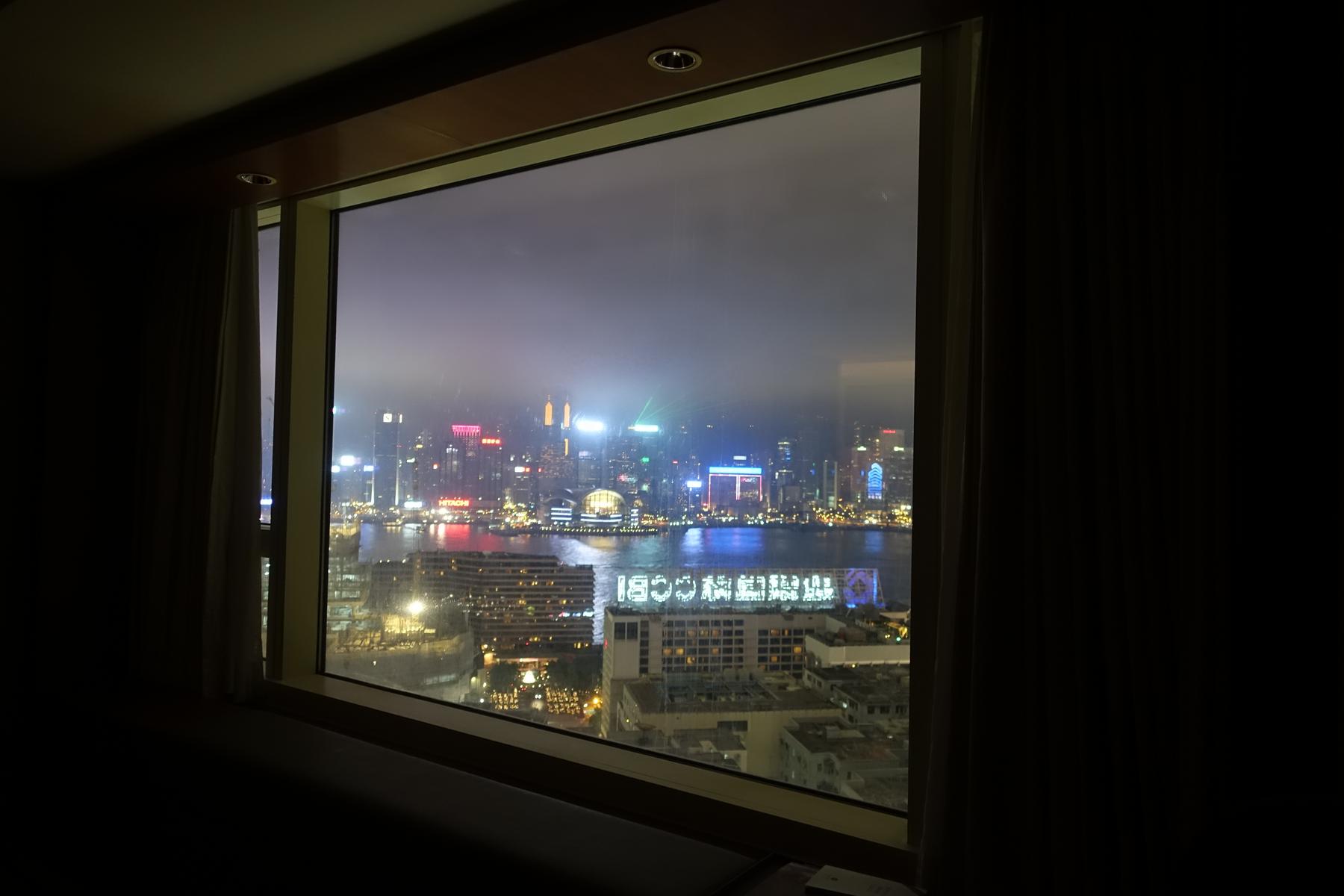 Night view of Hong Kong's Victoria Harbour from a Hyatt Regency hotel room.