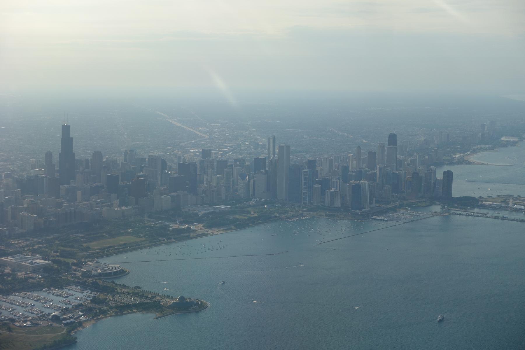 Hazy aerial view of the Chicago skyline along Lake Michigan.