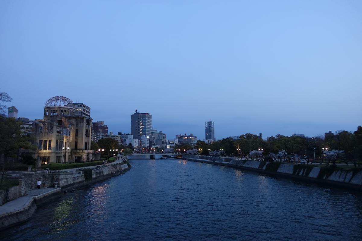 Night view of the Atomic Bomb Dome and cherry blossoms along the river in Hiroshima.