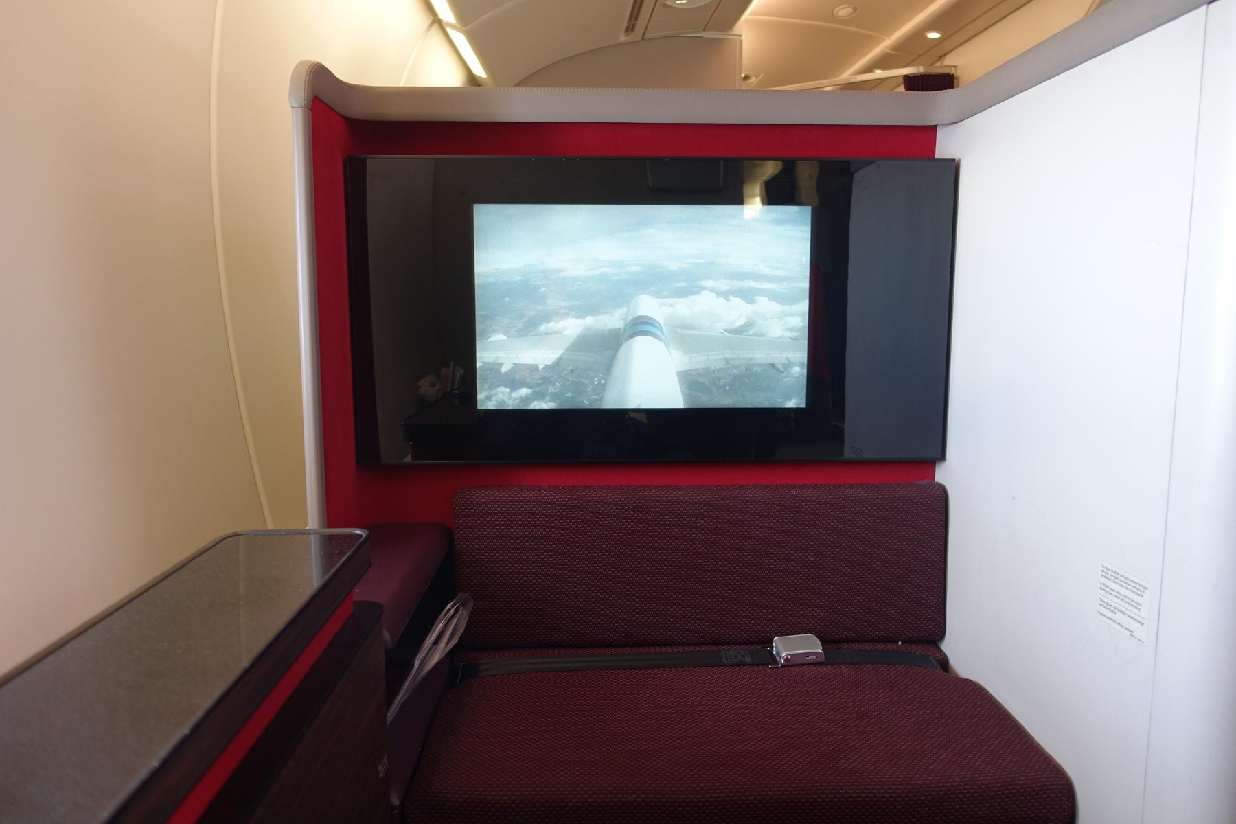 A Malaysia Airlines A380 First Class suite featuring a large screen showing an external camera view.