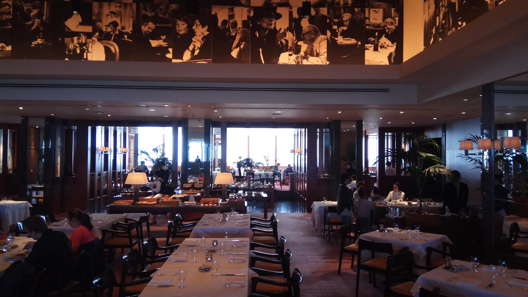 Elegant Club on the Park restaurant at Park Hyatt Tokyo with a breakfast buffet and wall mural.