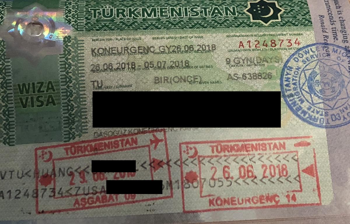 Turkmenistan visa page with entry and exit passport stamps.