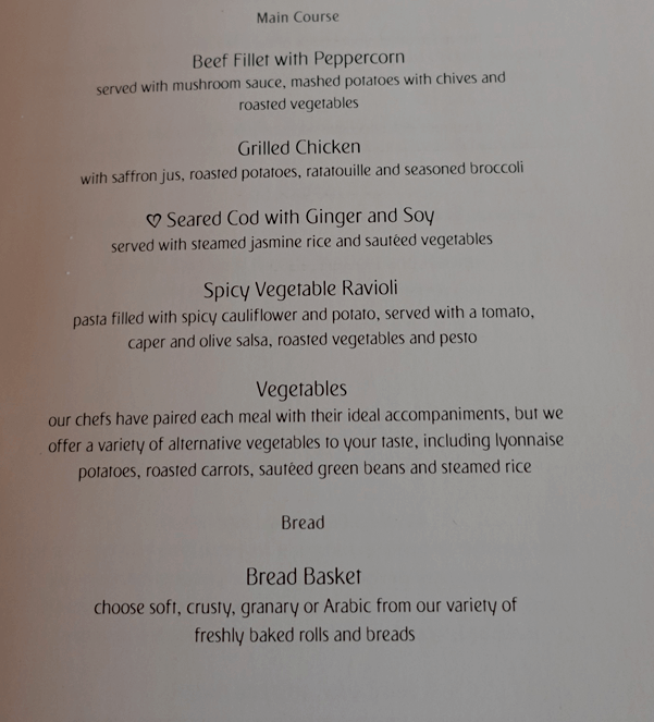 The Emirates First Class main course menu, featuring options like beef, chicken, cod, and a bread basket.