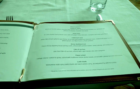 Emirates First Class menu open to the main courses page.