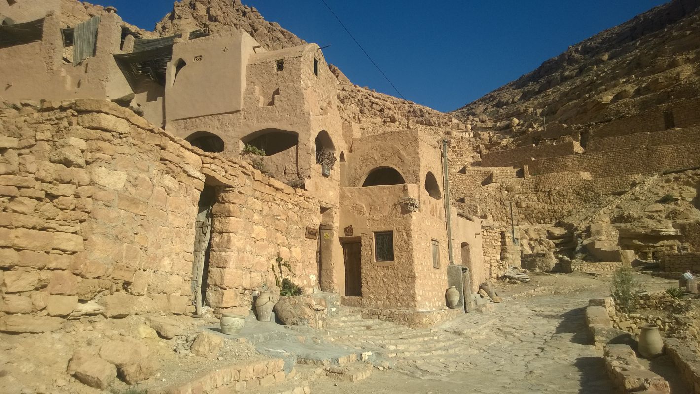 Original Star Wars set in Tunisia showing traditional earth-toned buildings integrated into a rocky mountainside.