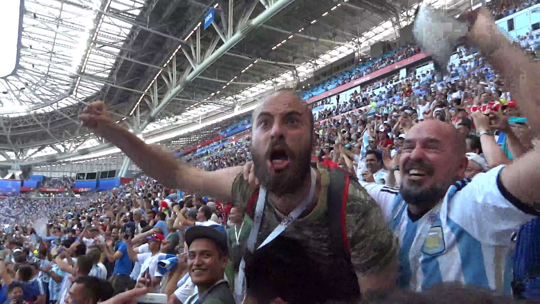 Argentine fans passionately cheer during the 2018 World Cup match against France.