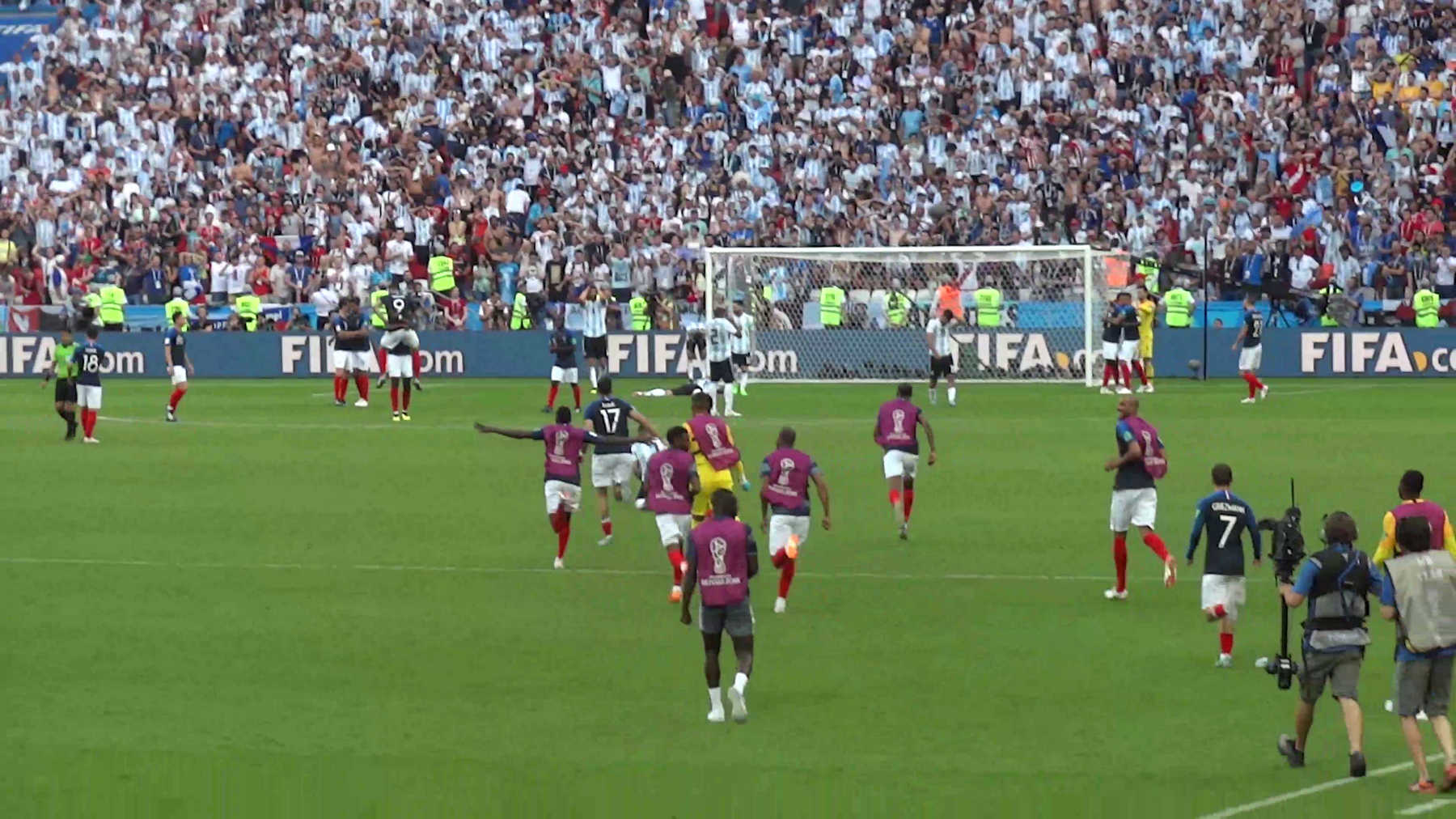 French players celebrate a goal against Argentina in a packed stadium during the 2018 World Cup.